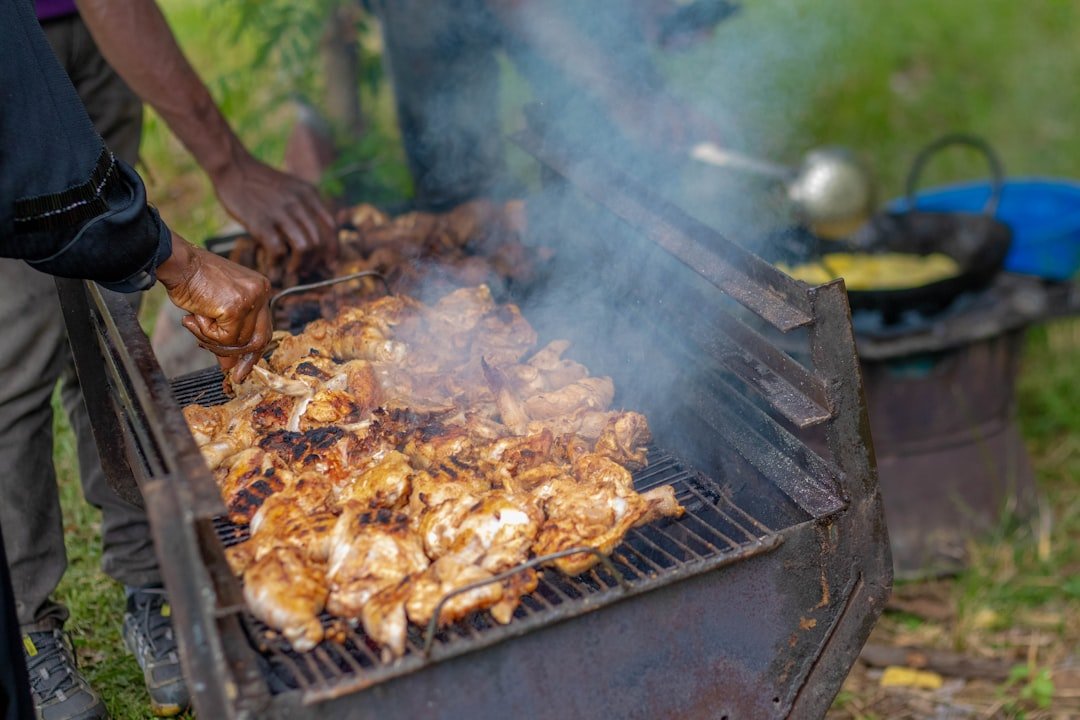 Carnivore Restaurant Nairobi grilling meat over charcoal fire