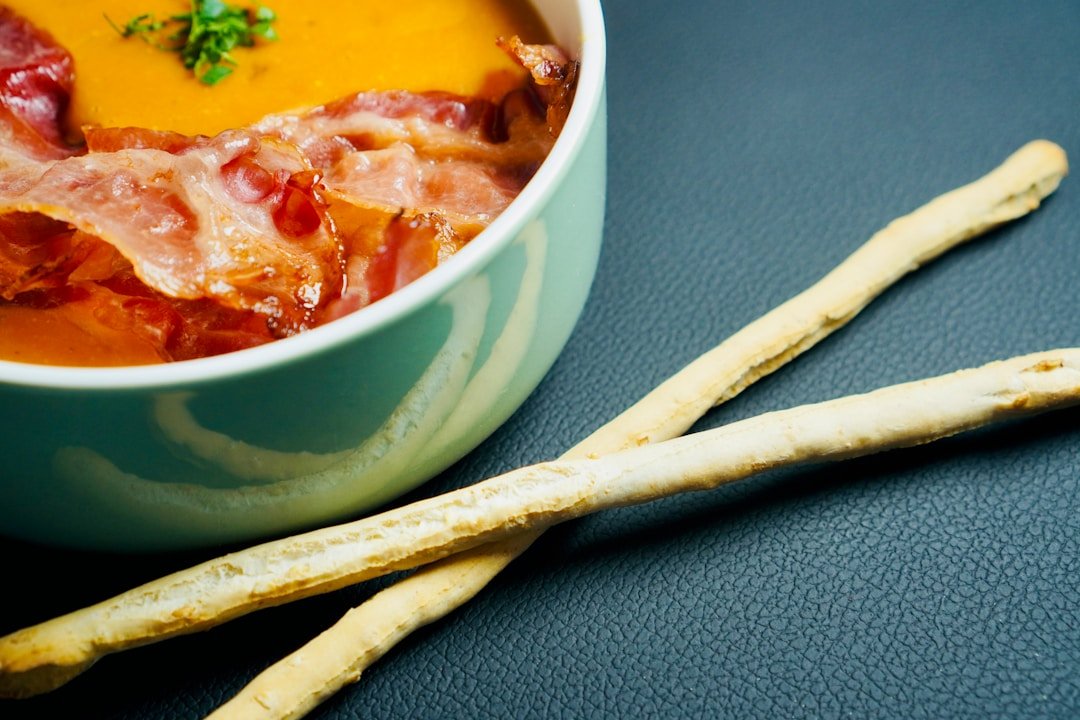 A pot of Kenyan dengu stew with tomatoes and spices, ready to serve