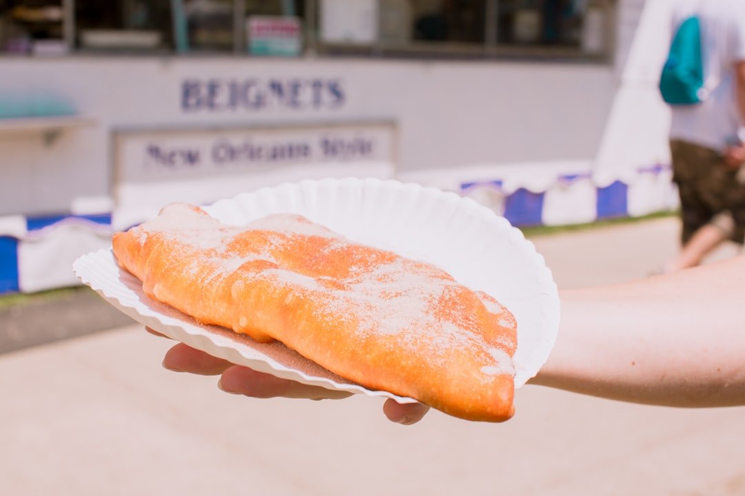 Freshly fried mandazi bread pieces on a plate - traditional Kenyan snack