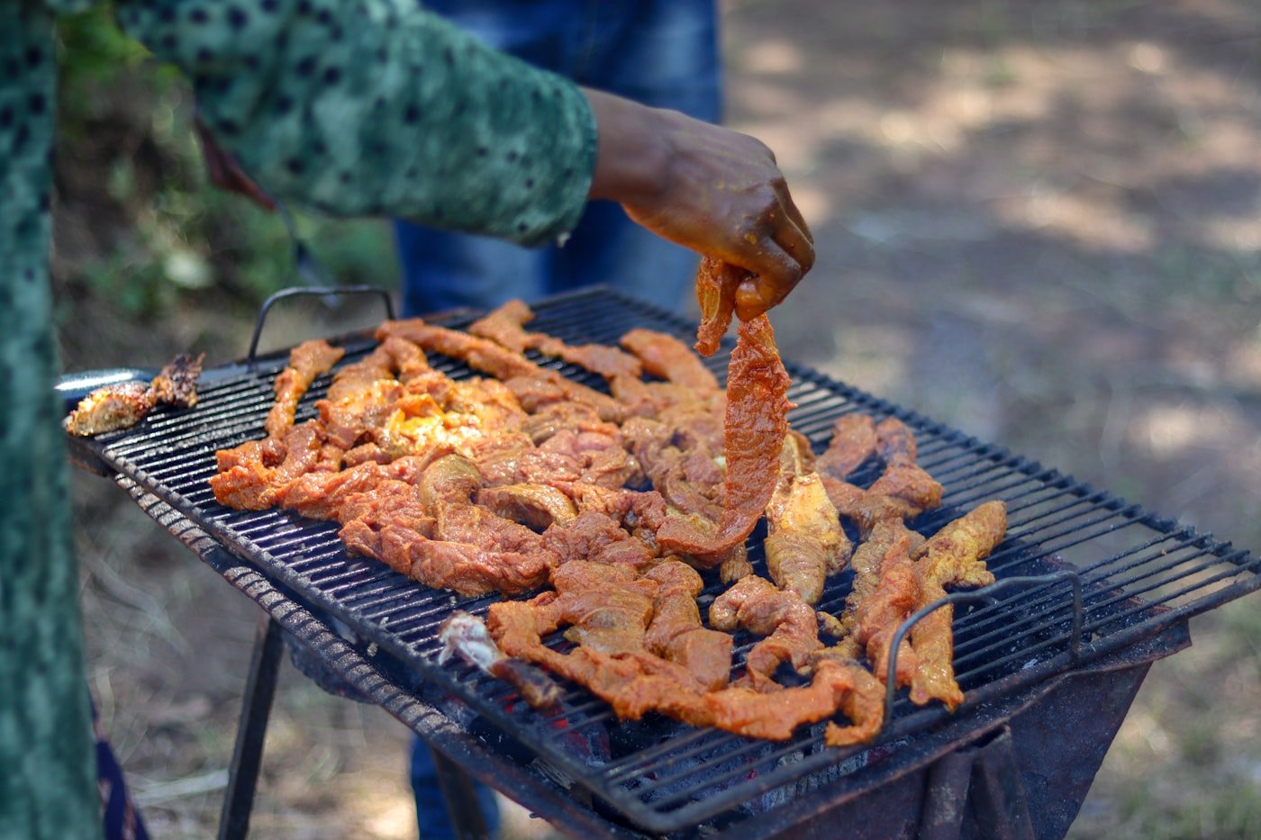 Nyama choma grilling over charcoal for a Madaraka Day feast in Kenya