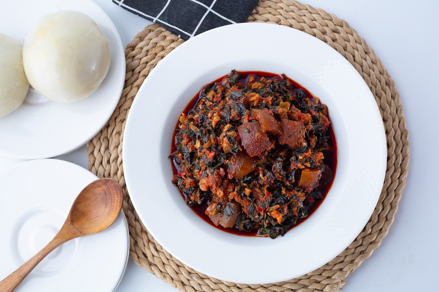 Kenyan ugali served with stew and sukuma wiki for a Madaraka Day spread